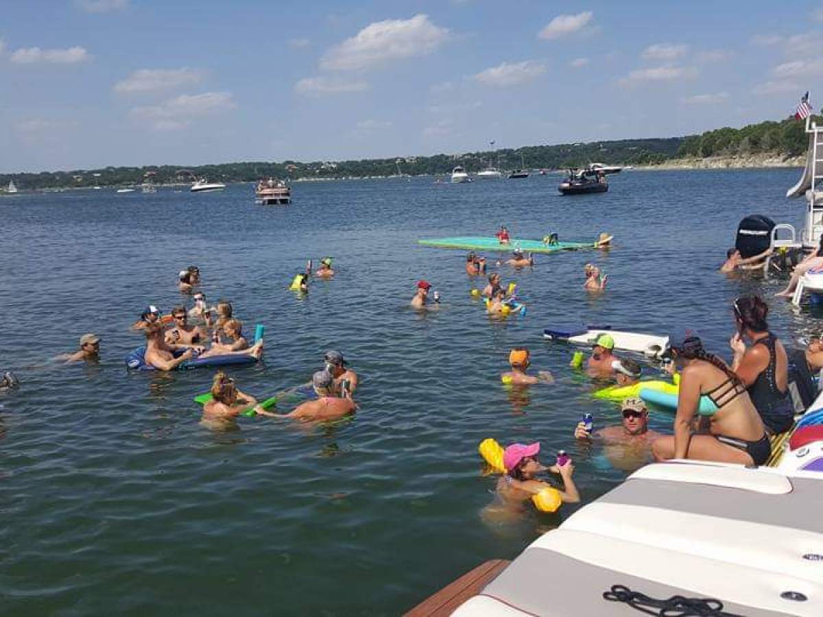 a group of people on a boat in the water