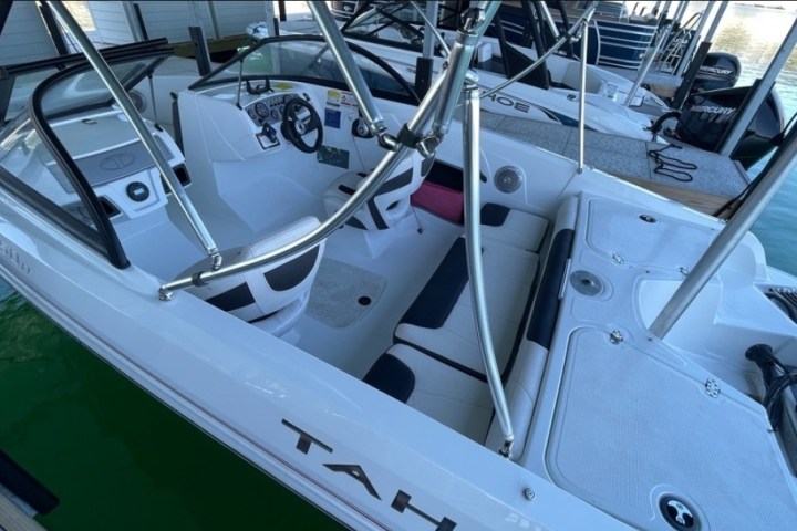 a boat sitting on top of a car