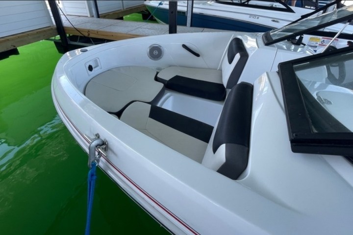 a boat sitting on top of a car